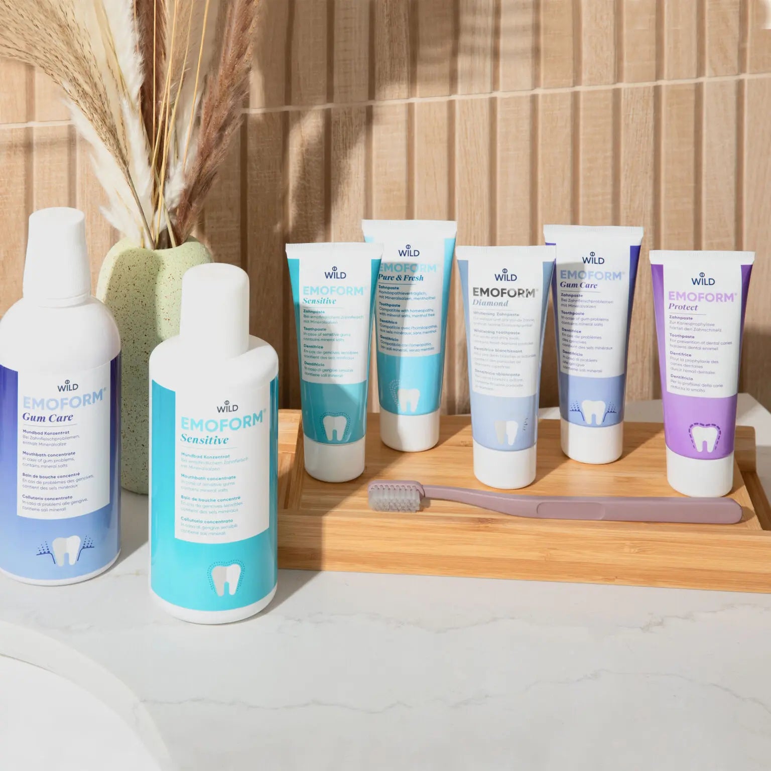 Close-up of DR. Wild Emoform Pure & Fresh Toothpaste being applied to toothbrush – gum care and fresh breath