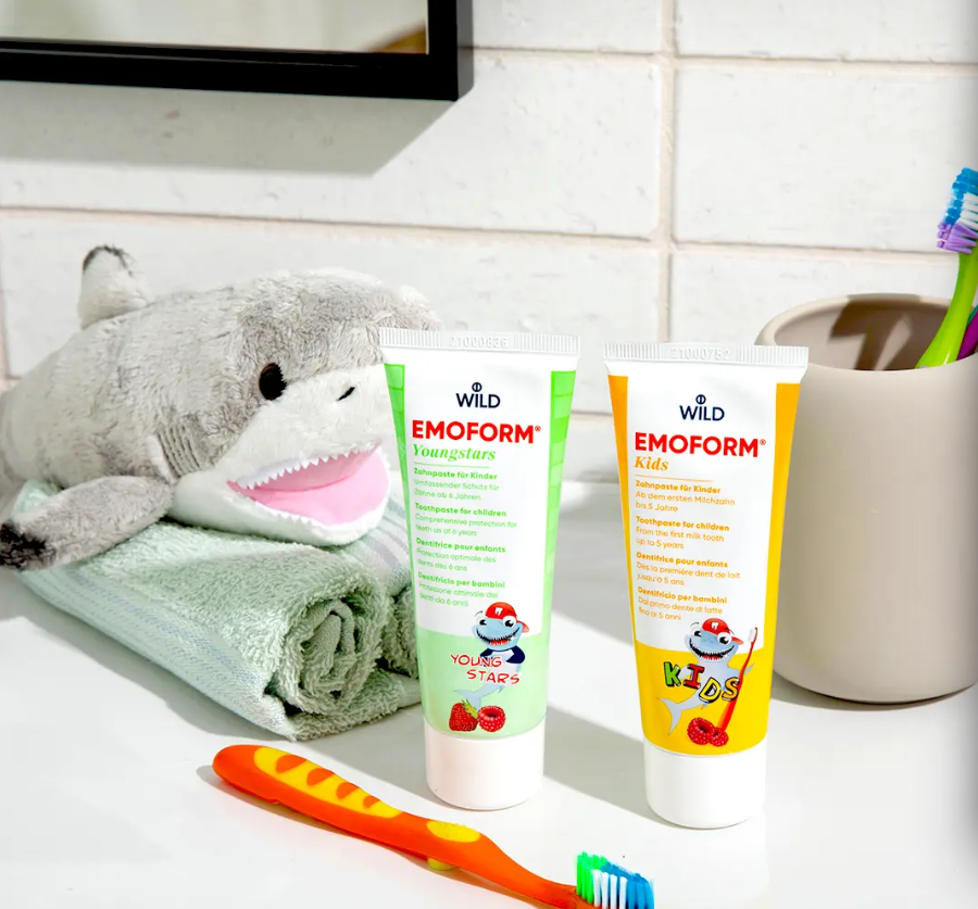 Close-up of DR. Wild Emoform Youngstars Toothpaste on toothbrush – kid-friendly dental care