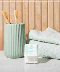 Close-up of DR. Wild TEBODONT-F Stretch Floss between teeth – fluffy cleaning thread