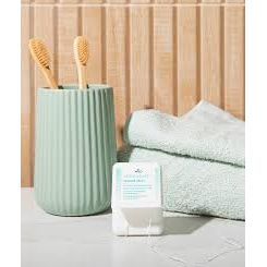 Close-up of DR. Wild TEBODONT-F Stretch Floss between teeth – fluffy cleaning thread