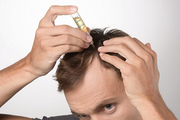 Close-up of Labo Suisse Crescina HFSC Complete Treatment 1300 Men vials and applicator – Swiss precision hair care