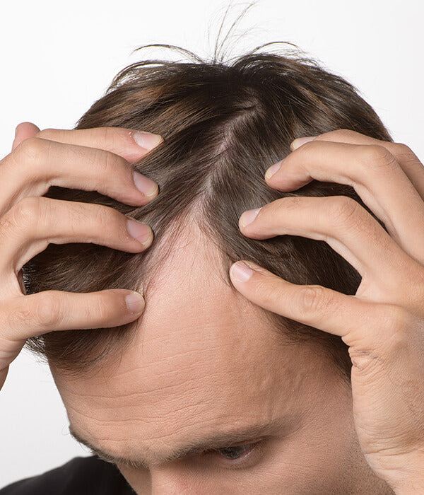 Close-up of Crescina HFSC Re-Growth ampoules and applicator – advanced Swiss hair care