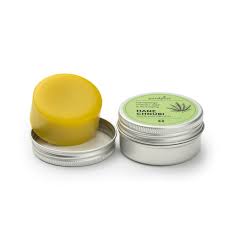 Close-up application: rubbing Hemp Bar onto hands/elbows for nourishment